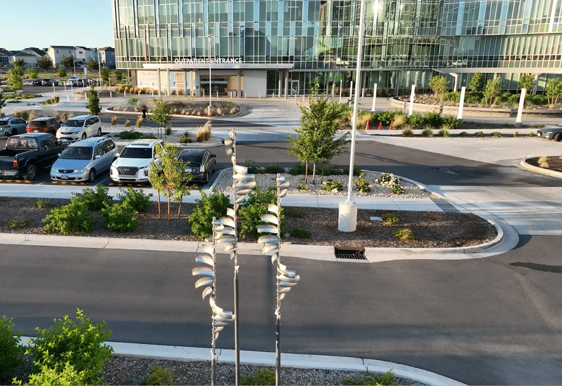 A parking lot with a row of cars parked in front of a building. AI generated content