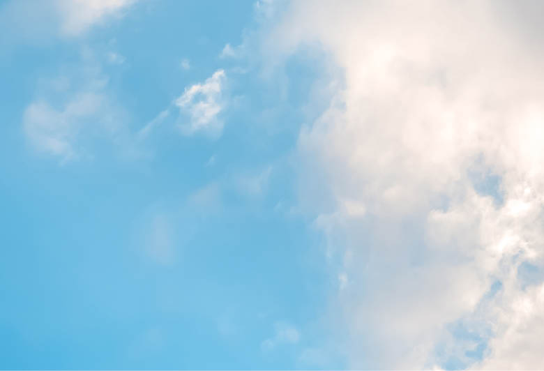 A cloudy blue sky with a few clouds. AI generated content