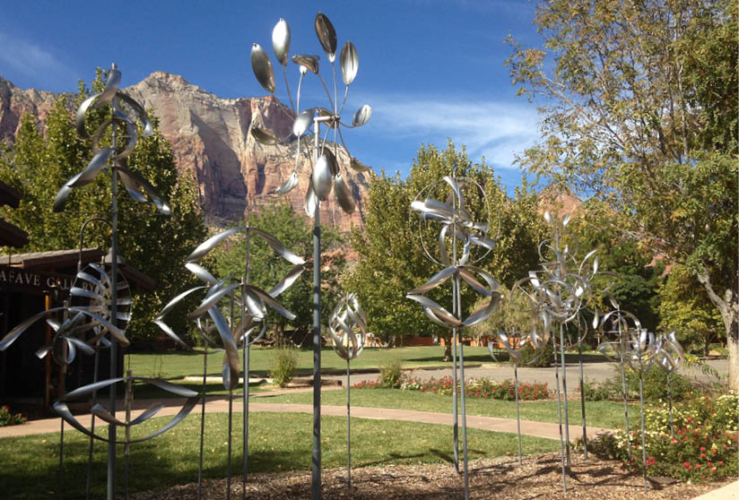 A row of wind catchers in front of a mountain. Description generated by AI