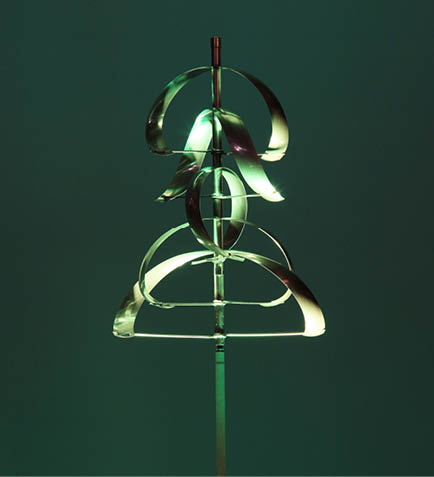 A green lighted metal sculpture of a tree. Description generated by AI