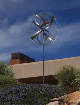 A windmill with a blue and purple background. Description generated by AI