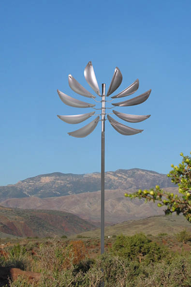 A large metal sculpture of a flower is standing in a field with a blue sky in the background. AI generated content