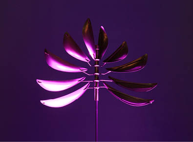 A purple and pink fan with a metal handle. Description generated by AI