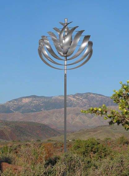 A large metal sculpture of a flower is standing in a field. AI generated content