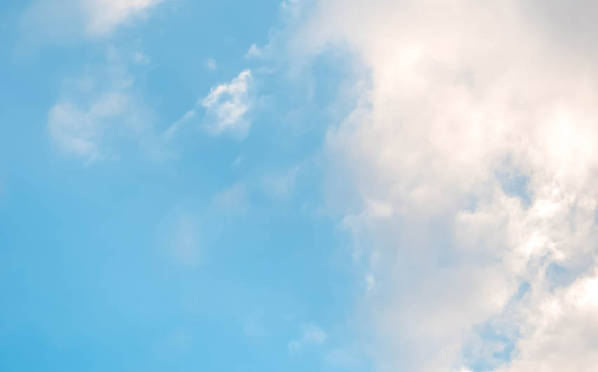 A cloudy blue sky with a few clouds. AI generated content