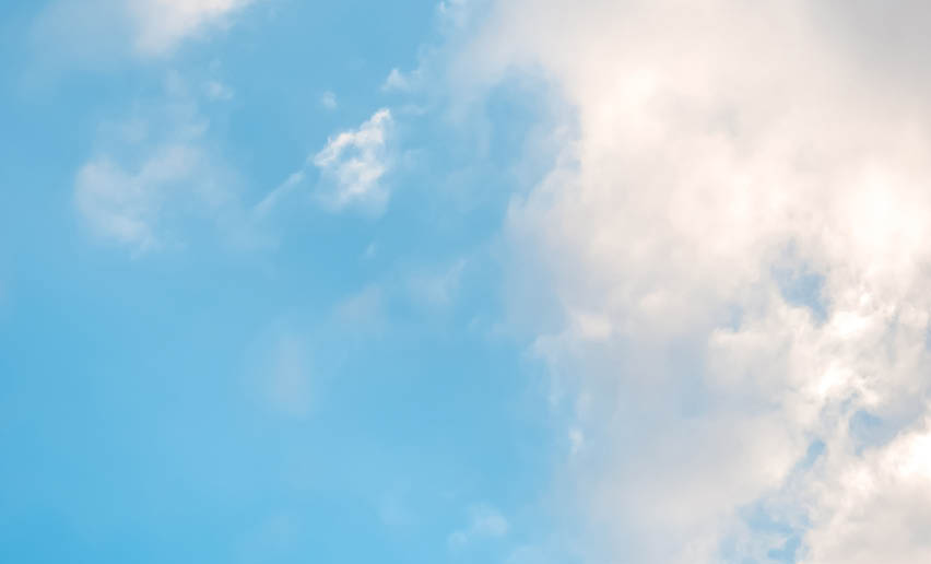 A cloudy blue sky with a few clouds. AI generated content