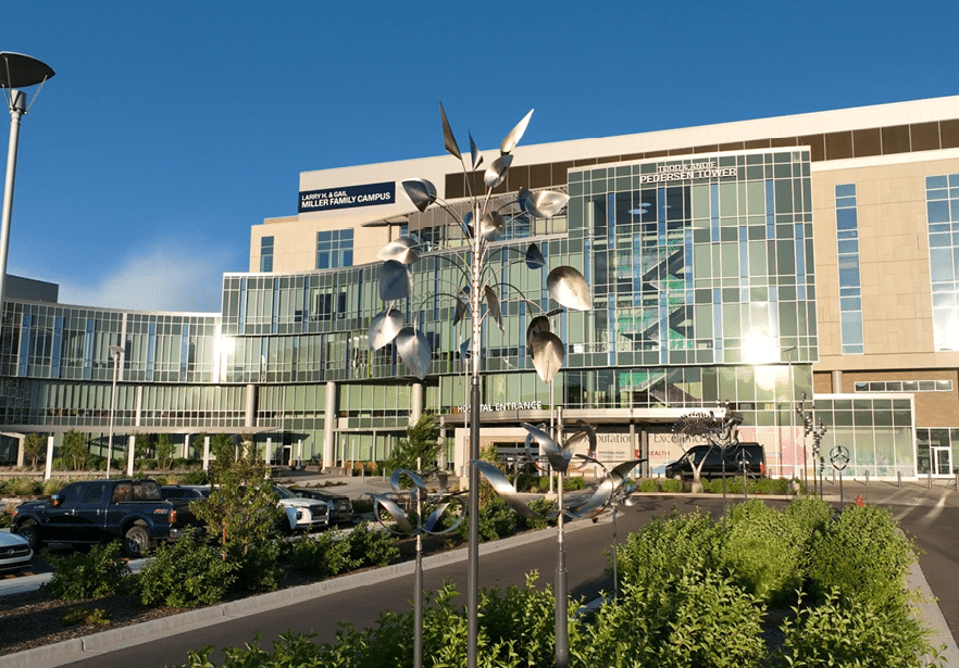 A large building with a blue sky above it. Description generated by AI