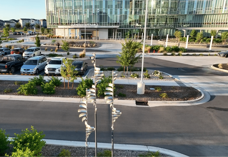 A parking lot with a row of cars parked in front of a building. AI generated content