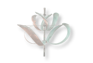 A bronze wind chime with a flower design. Description generated by AI